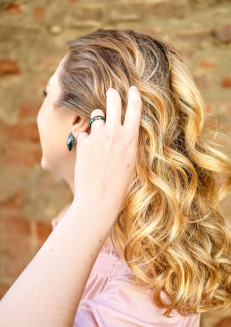 Stackable green resin ring with rose gold flakes on model hand