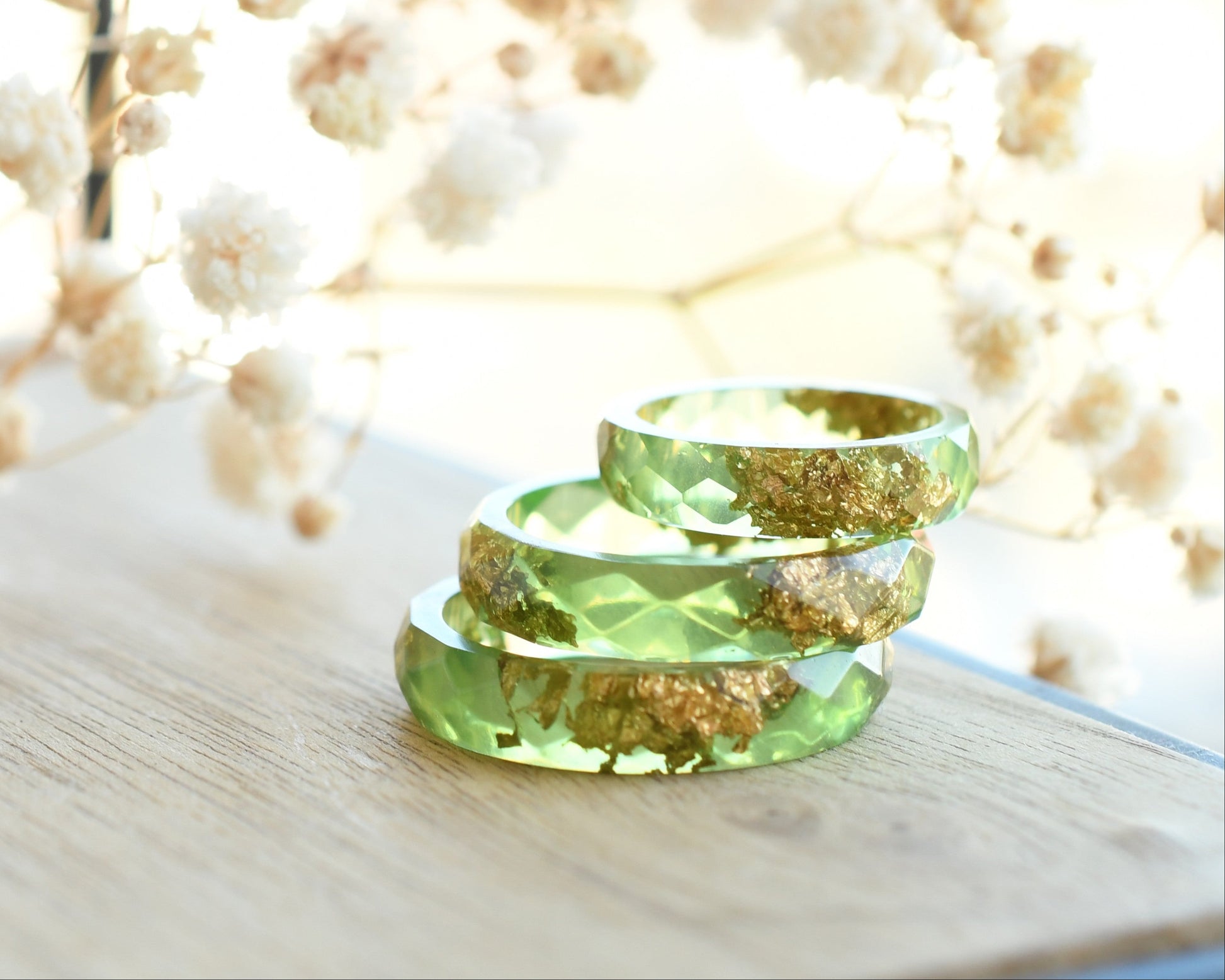 Smooth pastel green resin ring with shimmering gold flakes — handmade jewelry