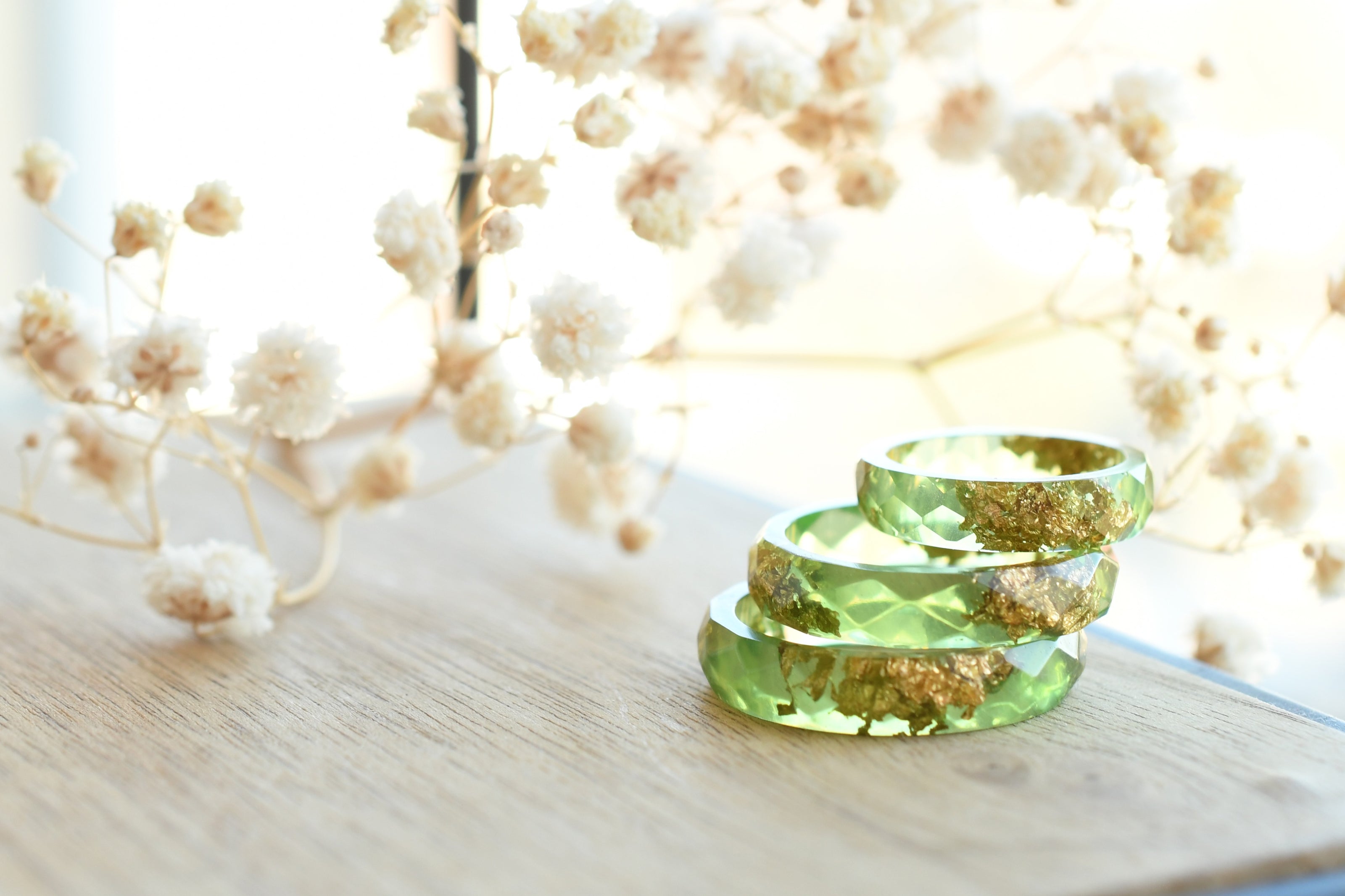Smooth pastel green resin ring with shimmering gold flakes — handmade jewelry