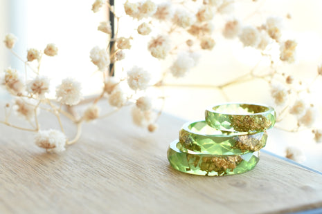 Smooth pastel green resin ring with shimmering gold flakes — handmade jewelry