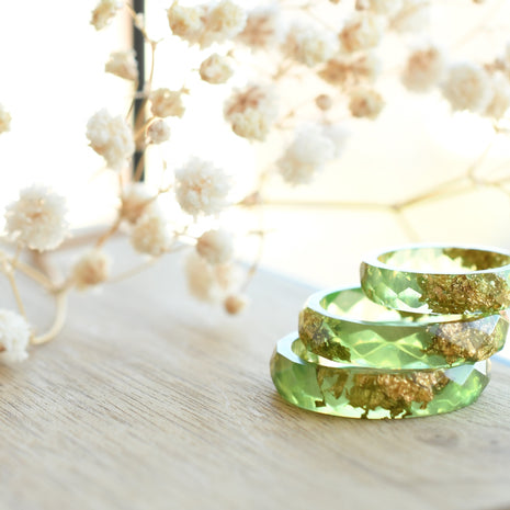 Smooth pastel green resin ring with shimmering gold flakes — handmade jewelry