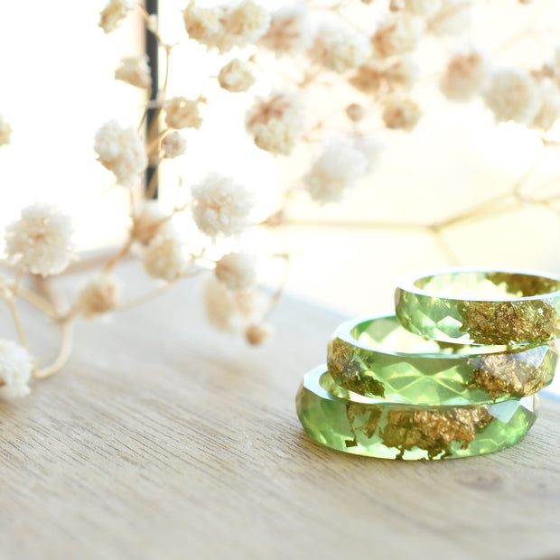 Smooth pastel green resin ring with shimmering gold flakes — handmade jewelry