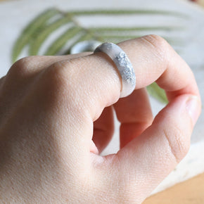 White resin ring with silver flakes worn on hand — unisex minimalist jewelry
