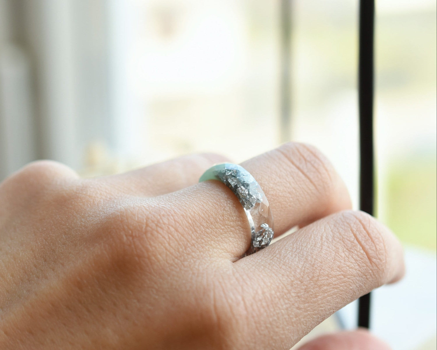 Mint resin ring with silver flakes worn on hand — unisex minimalist jewelry