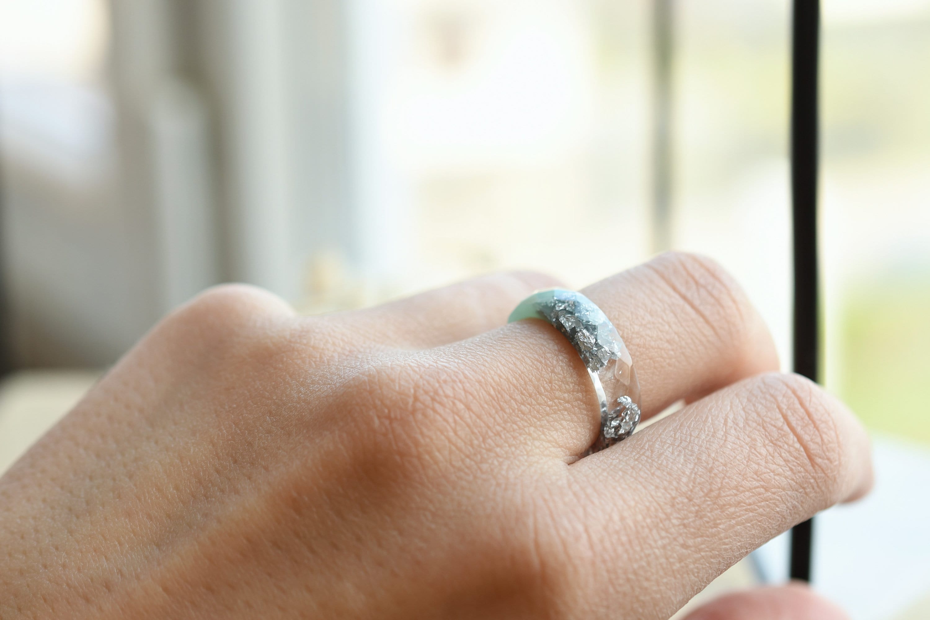 Mint resin ring with silver flakes worn on hand — unisex minimalist jewelry