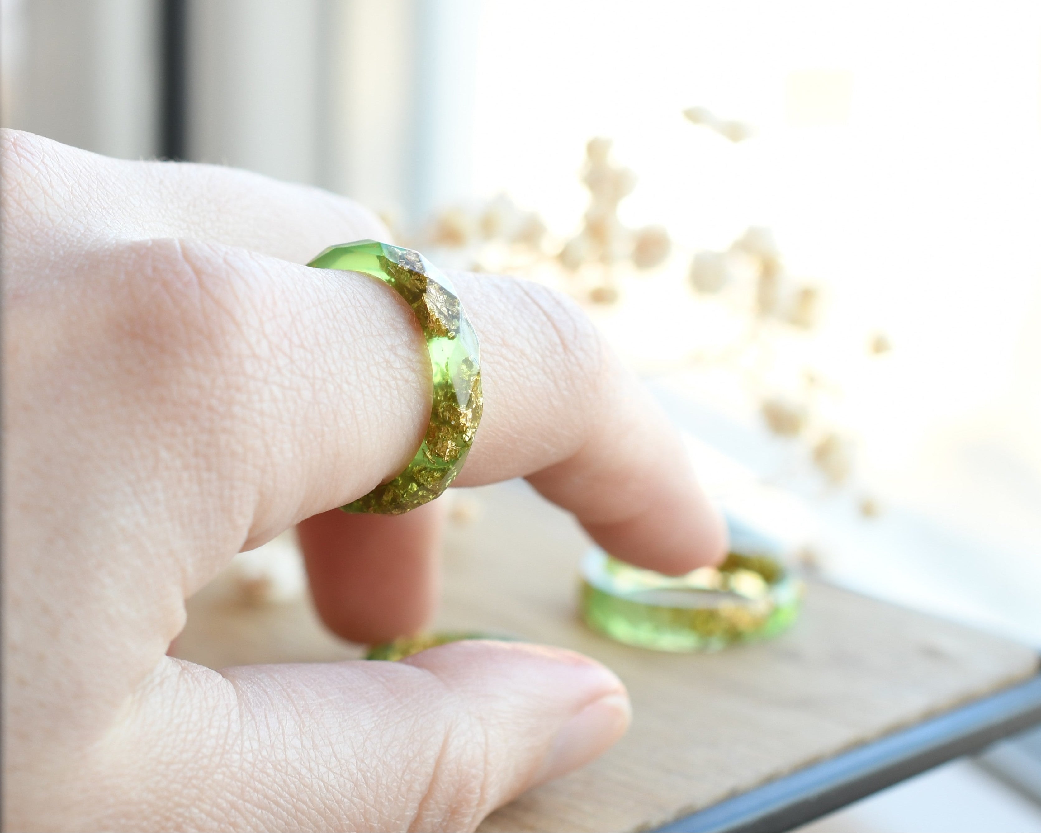 Light green resin ring worn on hand — unisex minimalist jewelry