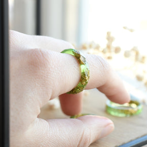 Light green resin ring worn on hand — unisex minimalist jewelry