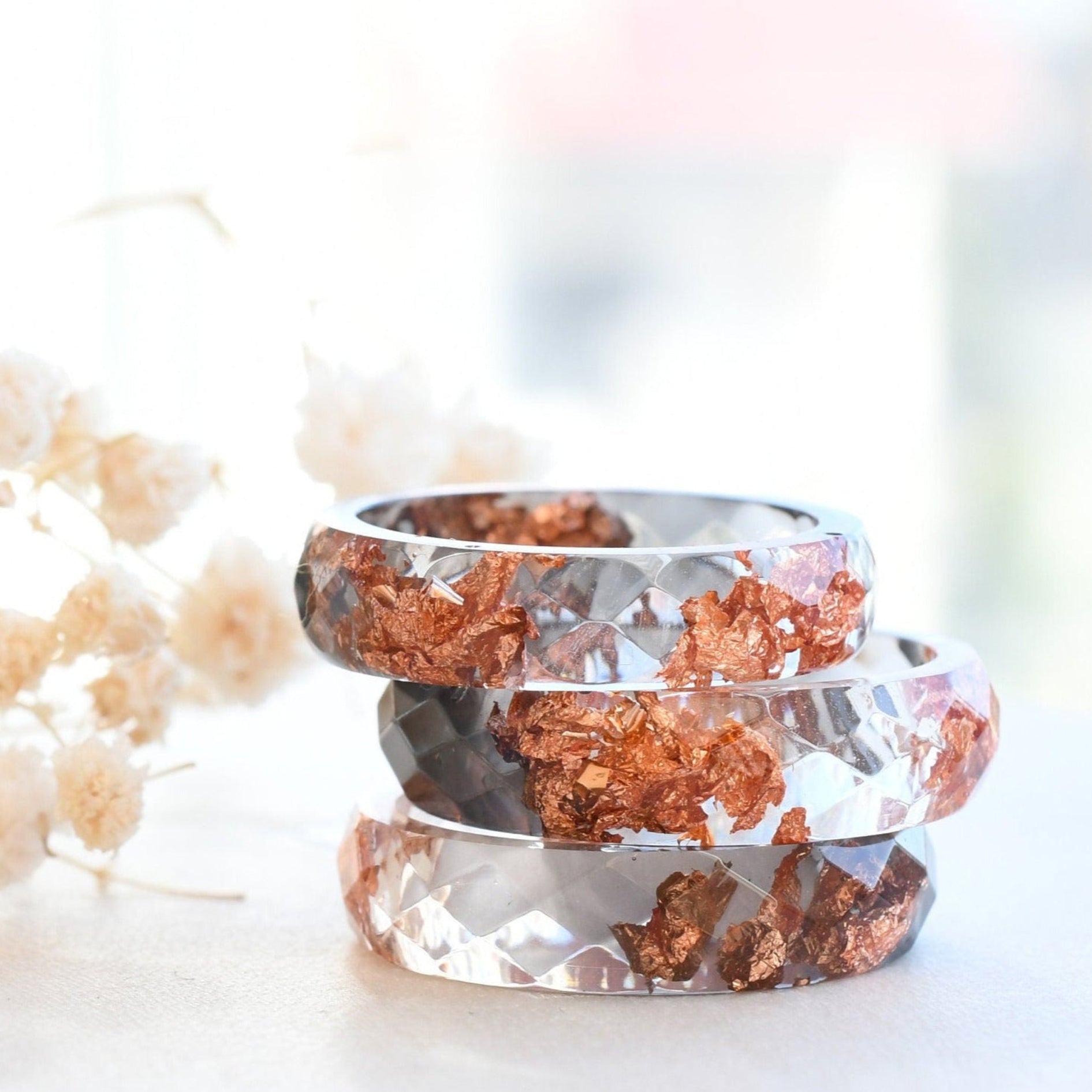Grey and transparent resin ring with rose gold flakes handmade by Resity in Vienna