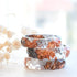 Grey and transparent resin ring with rose gold flakes handmade by Resity in Vienna