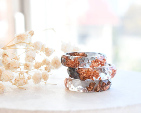 Grey and transparent resin ring with rose gold flakes handmade by Resity in Vienna