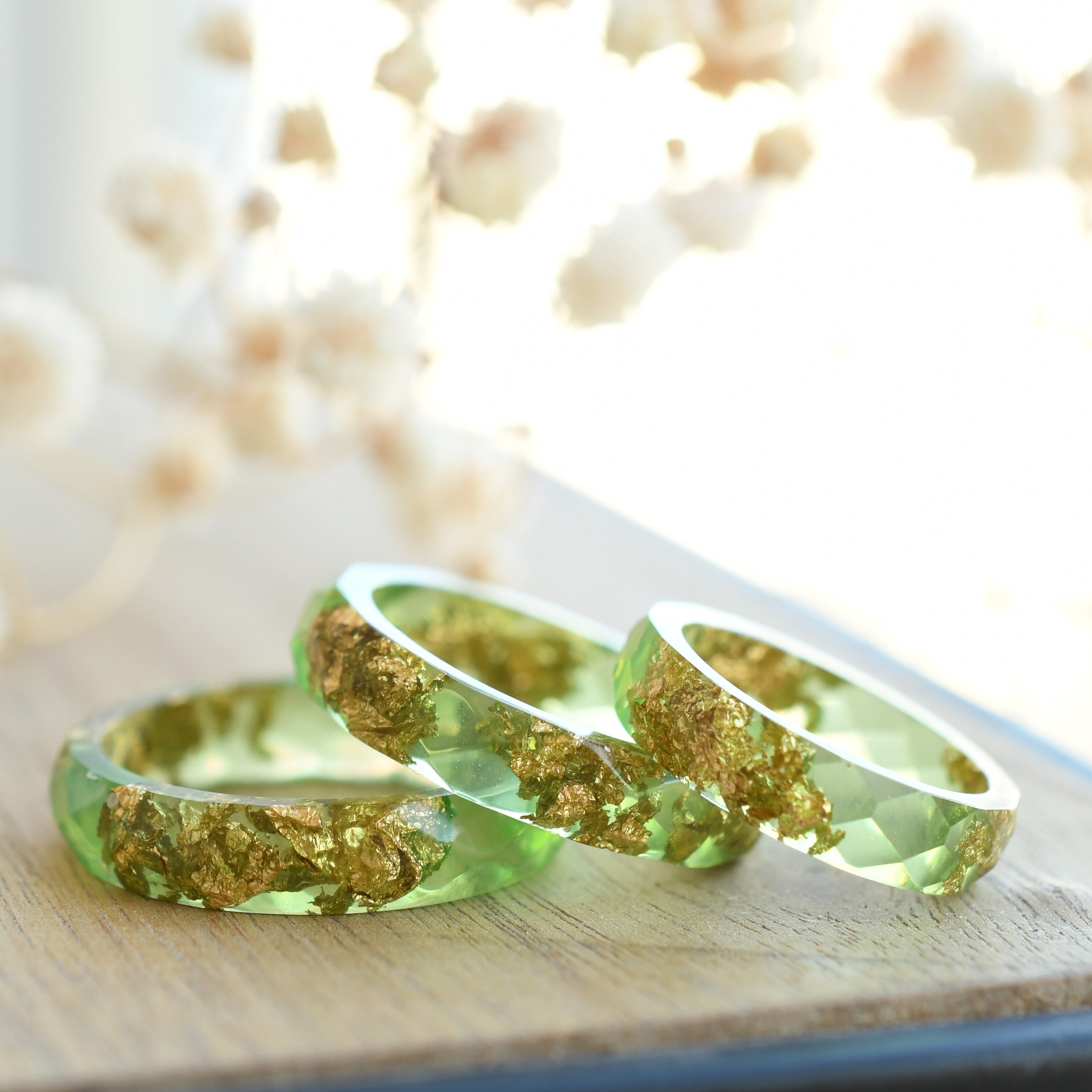 Light green resin ring with gold flakes handmade by Resity in Vienna