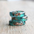 Minimalist jade ring styled with floral background