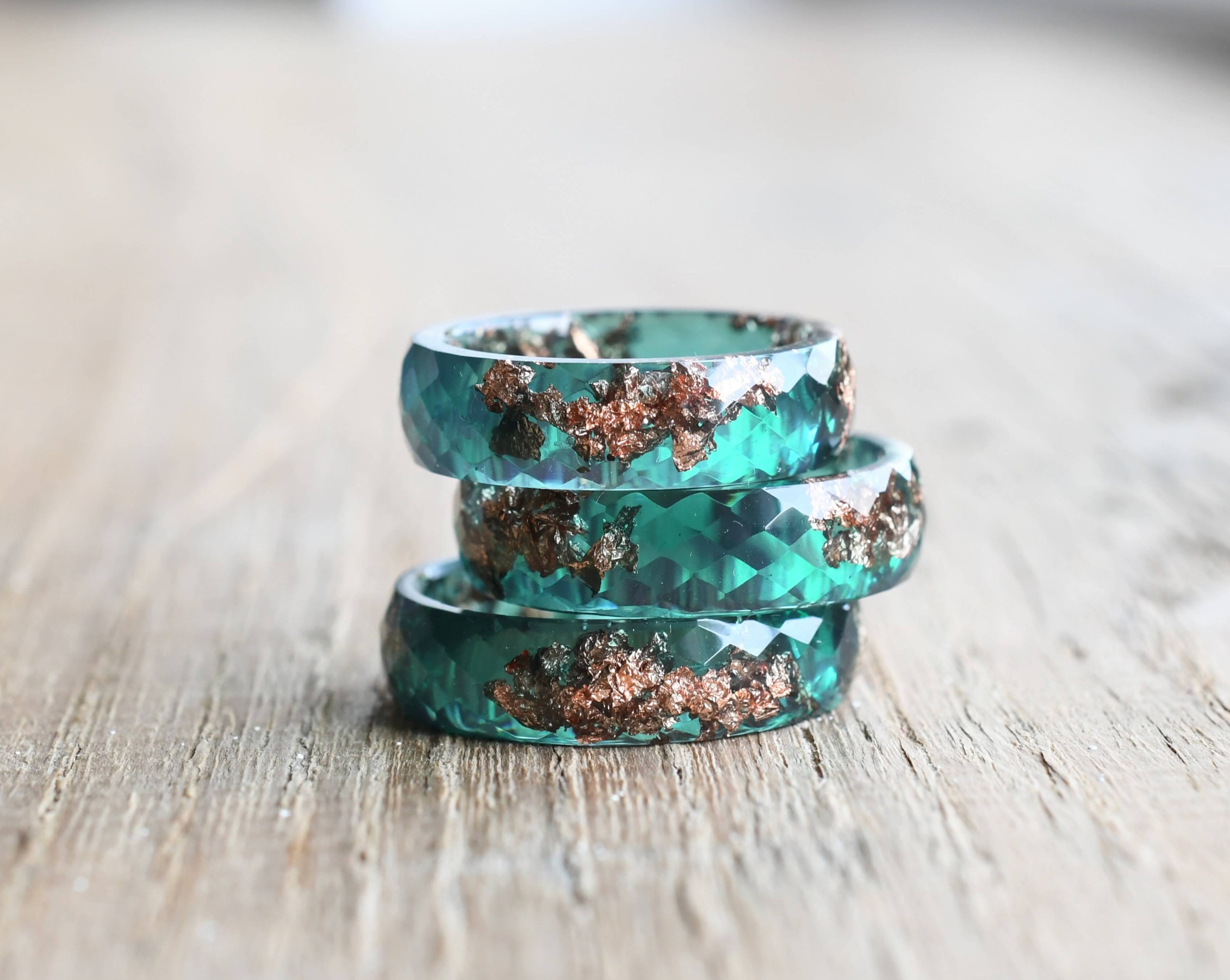 Minimalist jade ring styled with floral background