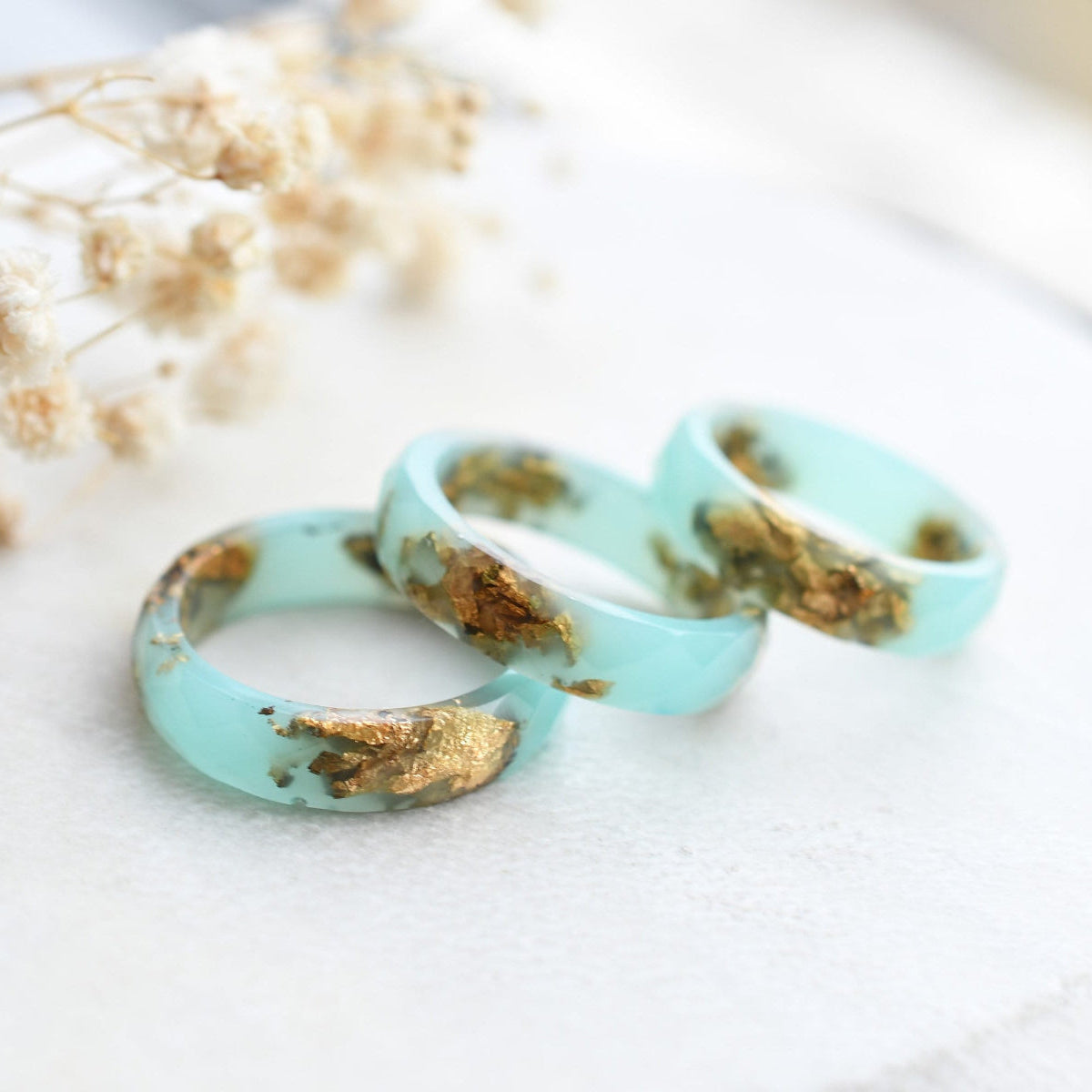 Turquoise resin ring with gold flakes handmade by Resity in Vienna