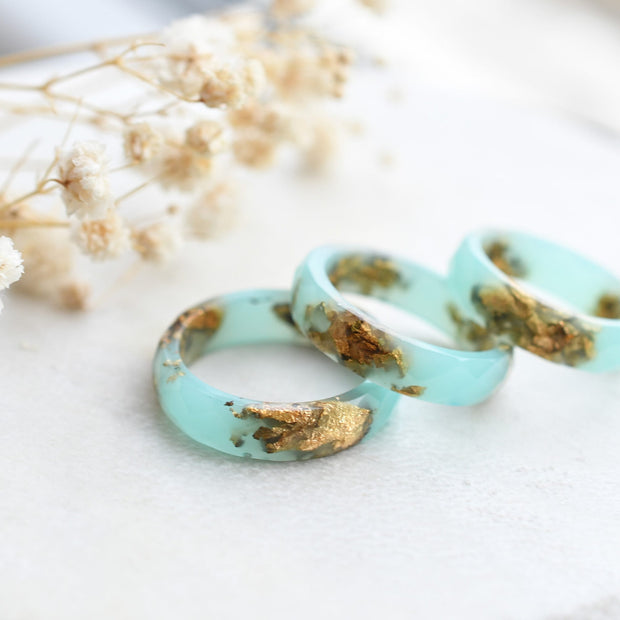 Turquoise resin ring with gold flakes handmade by Resity in Vienna