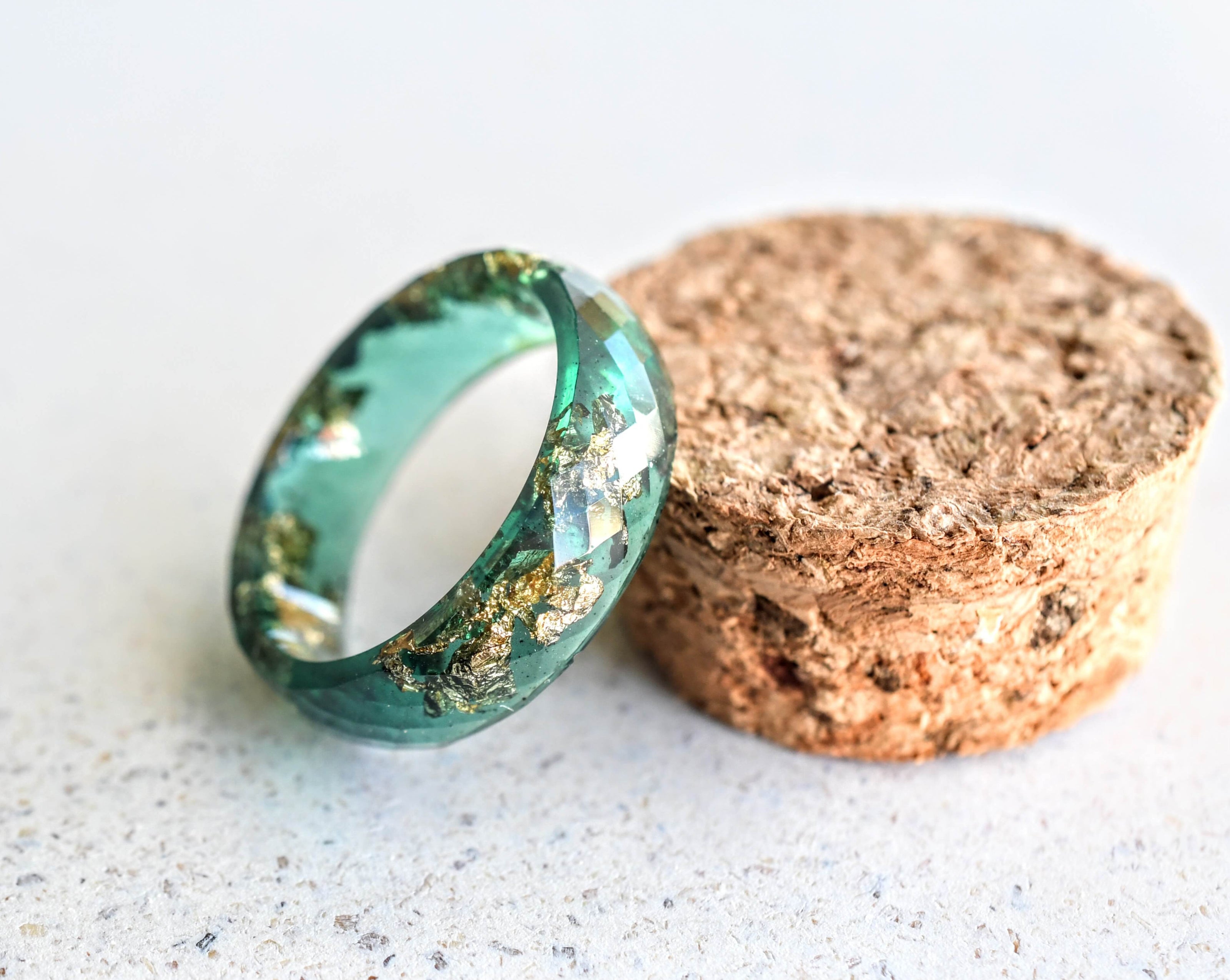 Deep Grove Ring stacked with other rings for a bold, layered botanical look