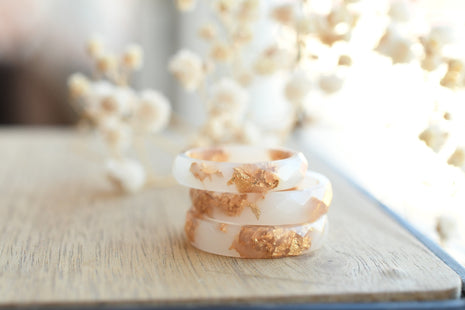 Smooth white resin ring with shimmering gold flakes — handmade jewelry