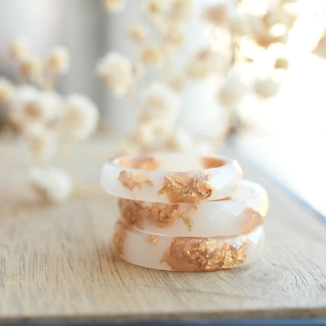 Smooth white resin ring with shimmering gold flakes — handmade jewelry