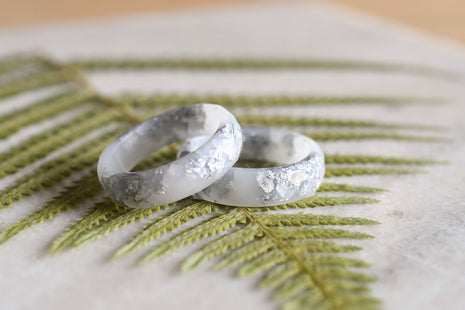 Smooth white resin ring with shimmering silver flakes — minimalist handmade jewelry