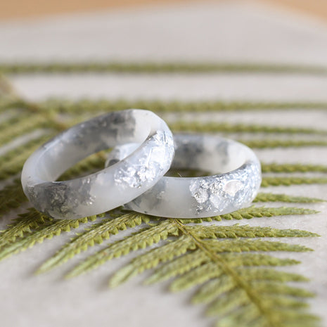 Smooth white resin ring with shimmering silver flakes — minimalist handmade jewelry