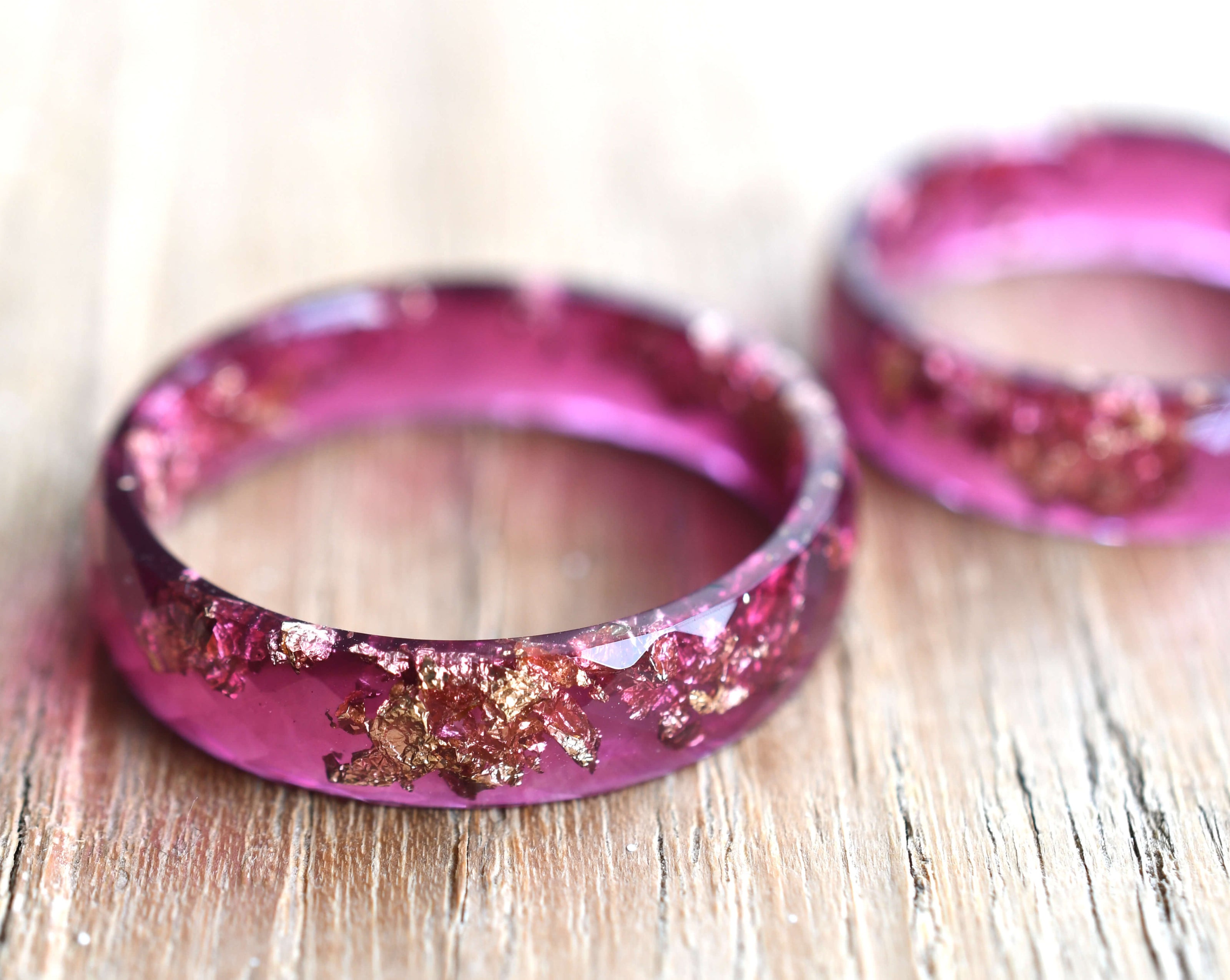 Wide magenta resin statement ring with gold leaf — modern handmade jewelry from Vienna