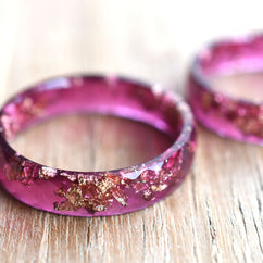 Wide magenta resin statement ring with gold leaf — modern handmade jewelry from Vienna